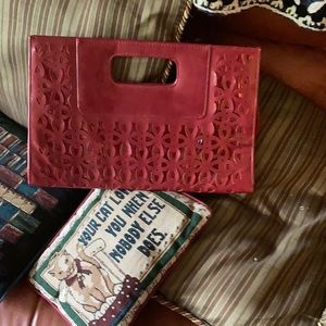 Envelope clutch with etched flowers.